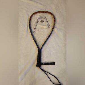 Head Radical Tennis Racket with Black Grip and Blue Frame